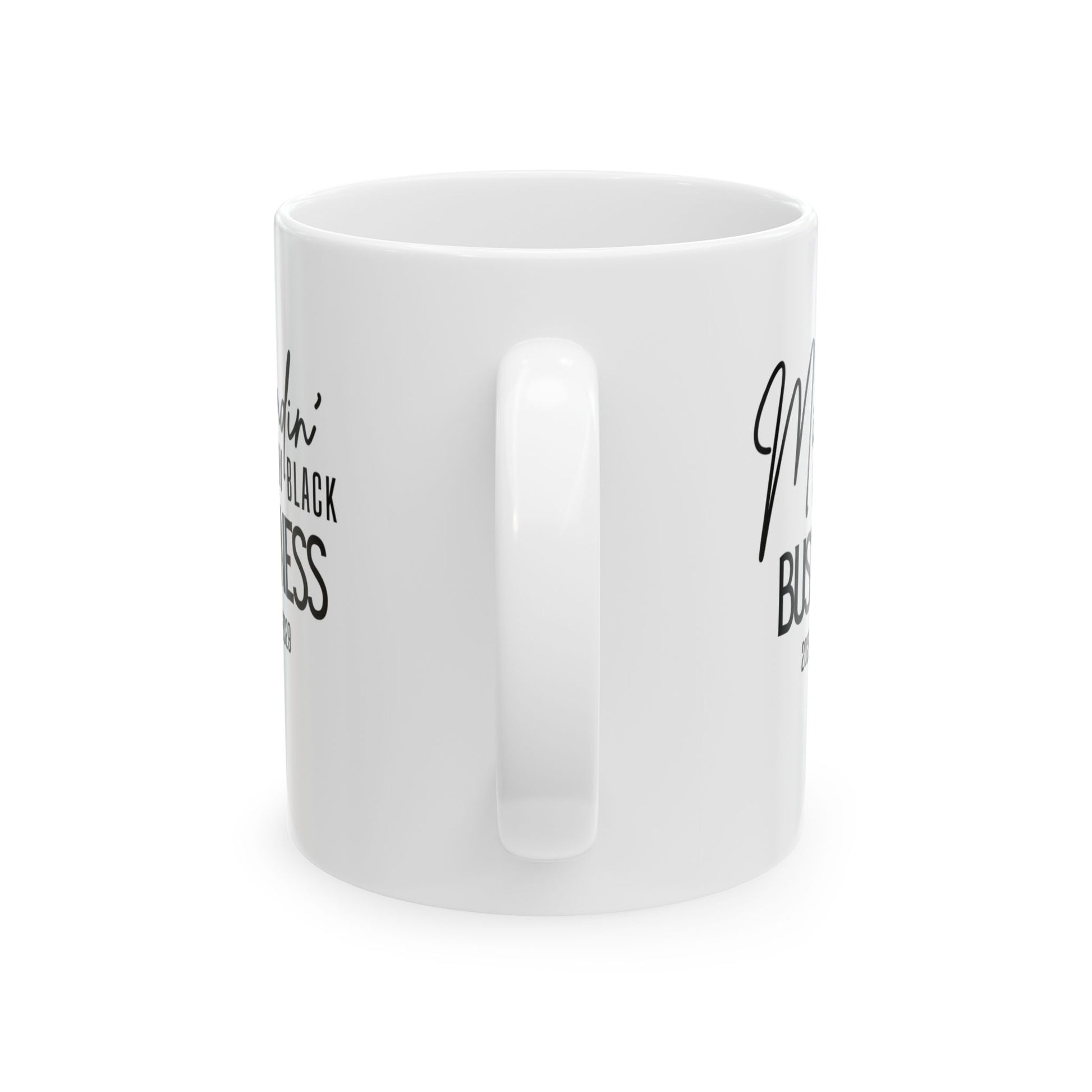 The back of an 11oz white mug with the words mindin my black business 2025-2029.