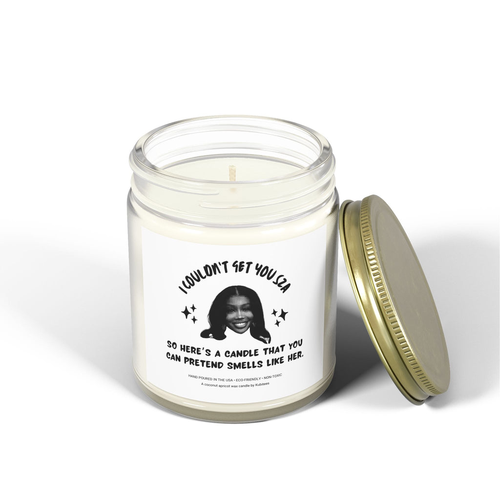 White candle jar with picture of SZA and words on front.